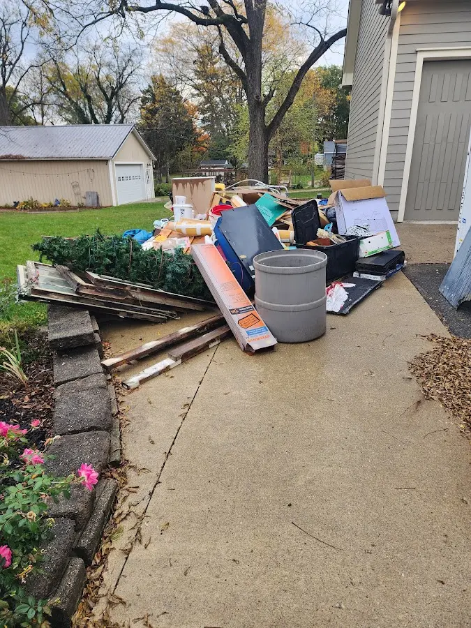 Dumpster being loaded with debris for 30 Yard Dumpster Rental in Taylor Creek
